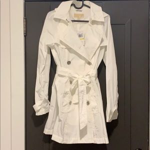 Michael Korda white raincoat